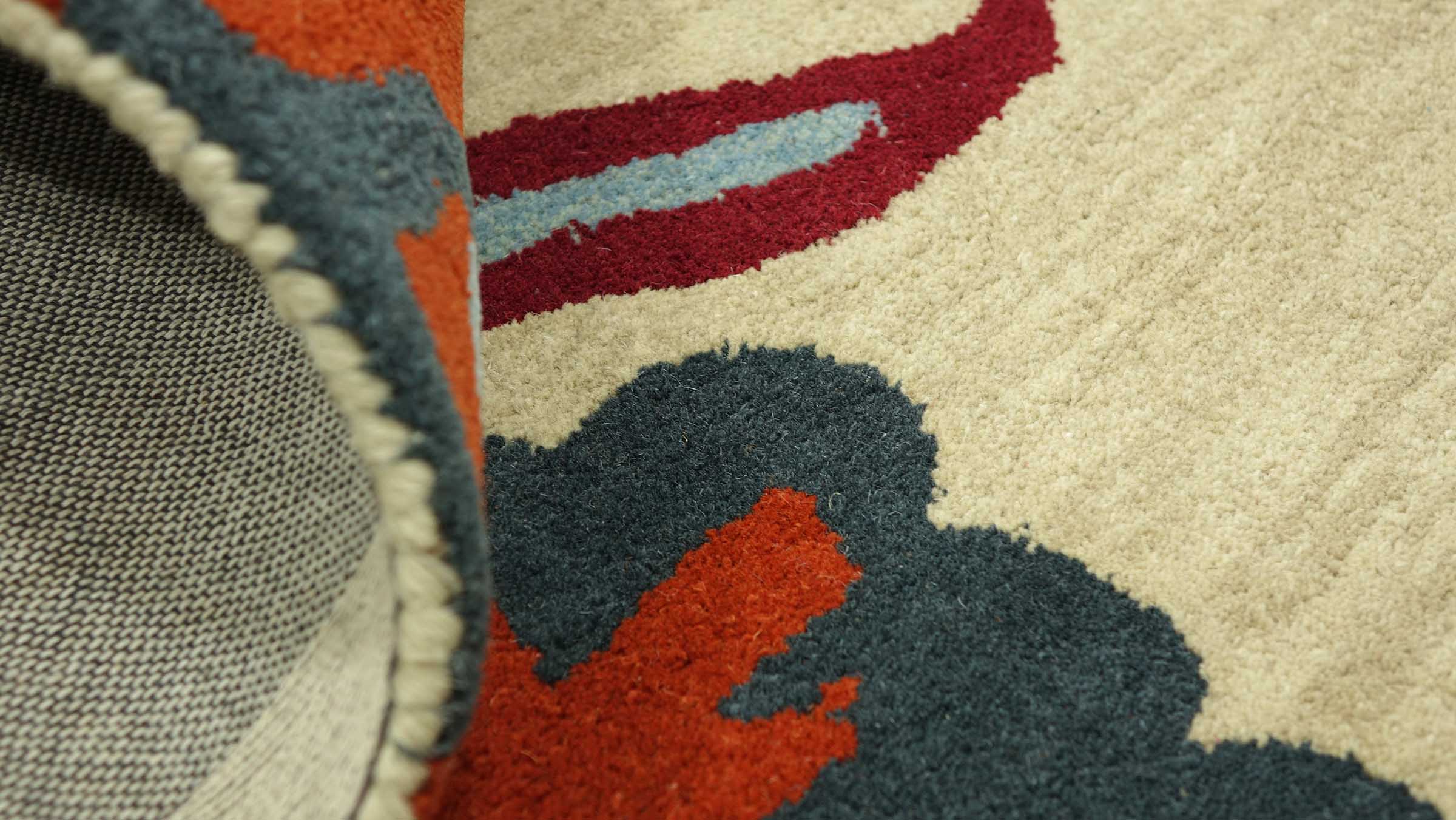 Malilinao Area Rug - Beige embossed trellis rug with small tassels